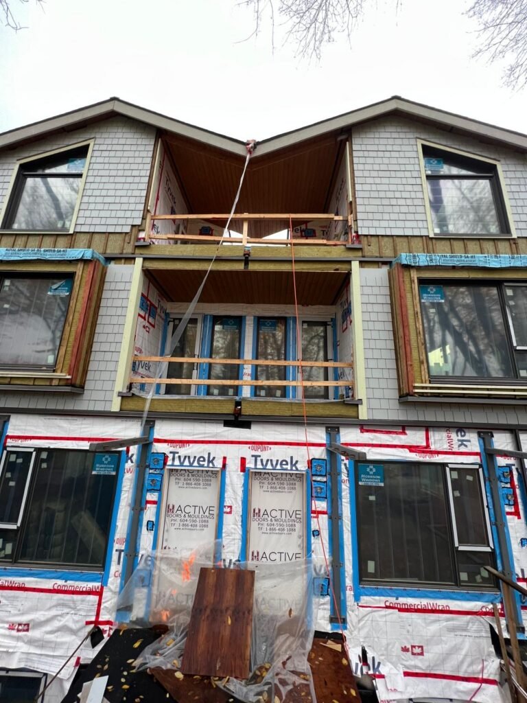 Grey siding, trim and roofing on a residential exterior project