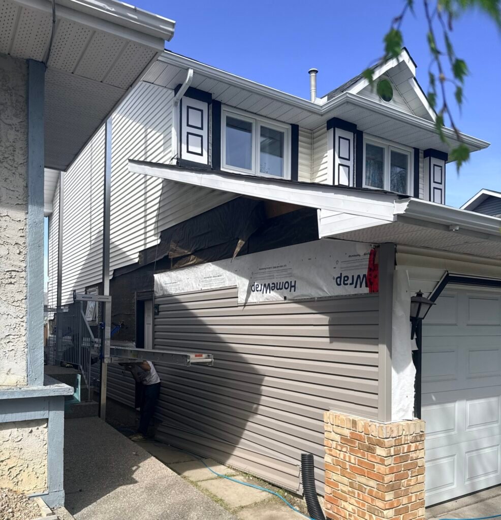 Class 4 roof gutters and board and batten vinyl siding in Country Hills NE Calgary